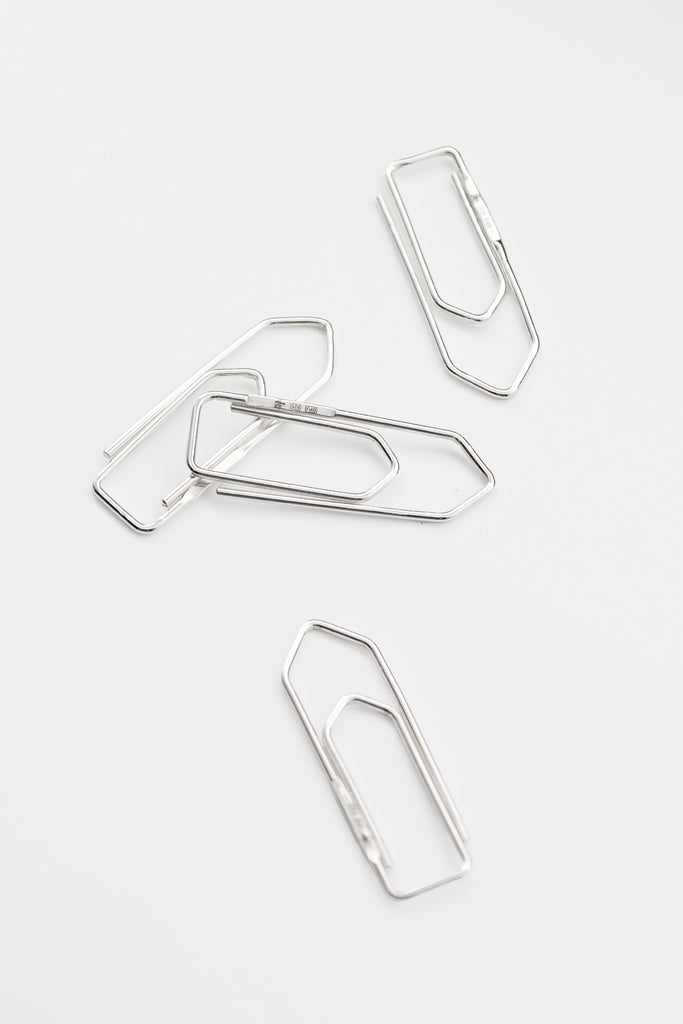 O.P Jewellery recycled 925 silver Clip pendants arranged on a light background.