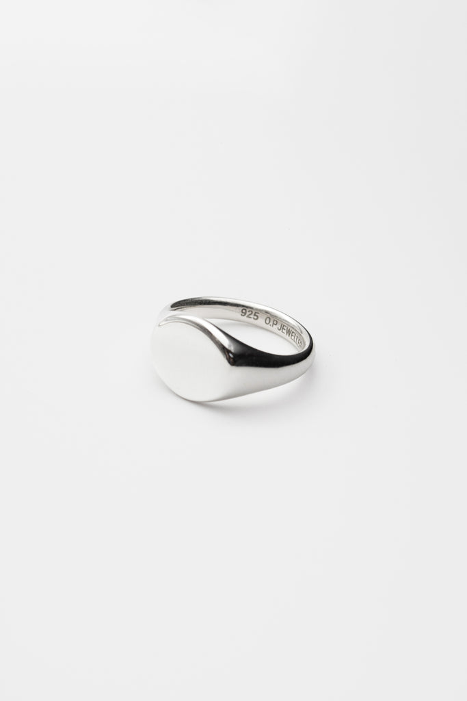 O.P Jewellery oval signet ring crafted in recycled 925 sterling silver with a plain face and inner stamp.