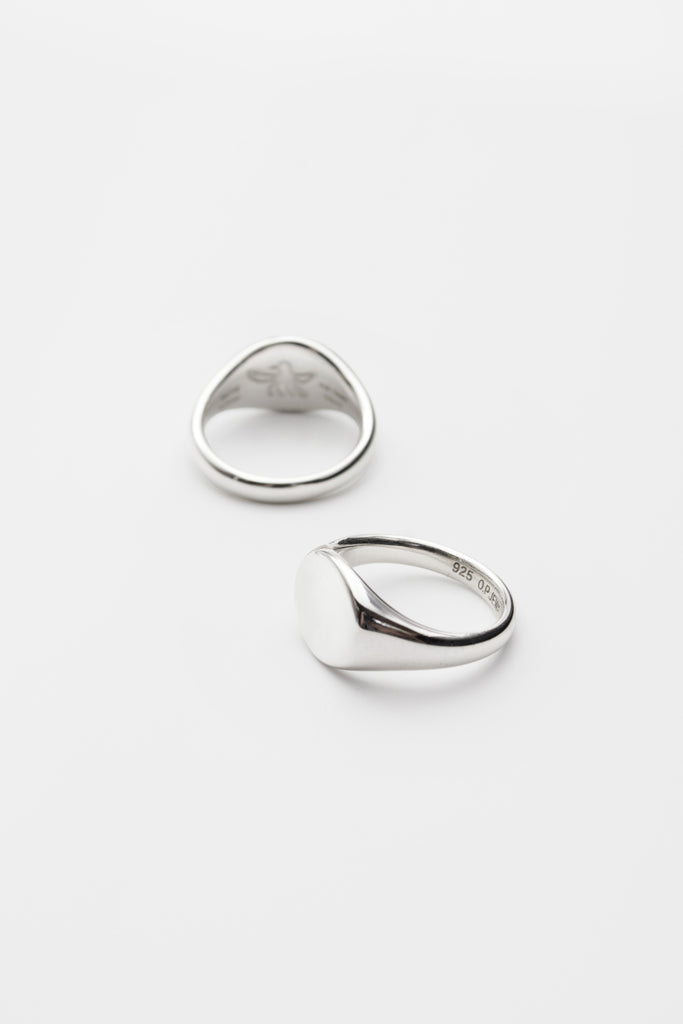 O.P Jewellery recycled 925 silver Oval Signet Rings showing the interior hallmarks and smooth face against a plain background.