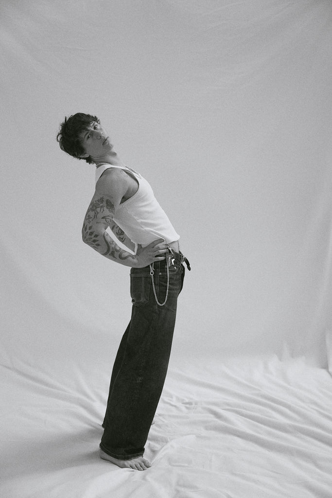 O.P Jewellery Key Hook and Chunky Silver Chain worn by a model in a white tank top and jeans against a plain background.